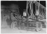 Lewis Hine child labor: Crescent Glass Works, Clarksburg , W. Va. At the Rolling Machine. Location: Clarksburg, West Virginia.