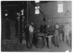Lewis Hine child labor: Men with Foot Mold and Boys. A West Virginia Glass Works. Location: West Virginia.
