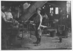Lewis Hine child labor: "Carrying-in" boy in Alexandria Glass Factory, Alexandria, Va. Works on day shift one week and night shift next week. See photo 2261. Location: Alexandria, Virginia.