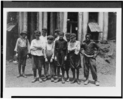 Lewis Hine child labor: Some of the youngsters on day shift (next week on night shift) at Old Dominion Glass Co., Alexandria, Va. I counted 7 white boys and several colored boys that seemed to be under 14 years old. The youngest ones would not give names, but the following are a few: Frank Ellmore, 913 Gibbon St., apparently ten or eleven. Been there three months. Dannie Powell, 307 Columbus St., Henry O'Donnell, 1923 Duke St. Leslie Mason, 912 Wilke St. Location: Alexandria, Virginia.